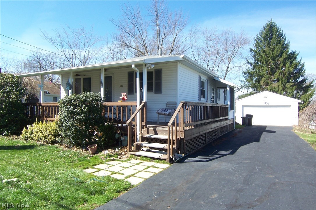 Very good condition ranch w/2+ car detached garage! Wrap around covered porch. This was a 3 bed ranch however after kids moved out, owners had living room enlarged taking some of bed making it a den. Professionally done. Gas fireplace added to living room! Furnace & AC, 1999. Water softener about 2018, vinyl siding & roof 2007 and new well pump 2020! Replacement windows & glass block in basement! Nice hardwood floors! Basement shower, rec room and bedroom!
