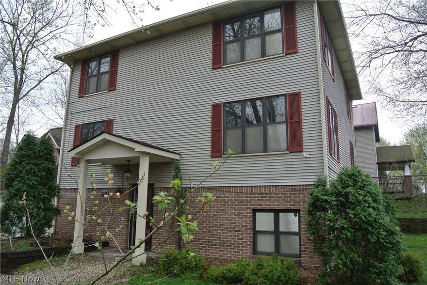 Very unusual house layout perfect for a multi-generational family with loads of separate living space with privacy too. This was once a three unit property but has been converted back to single family with two kitchens and four laundry areas and yes it really has 5 full baths! The layout is similar to a bi-level. Walk in and there are steps to up or down. The main floor (up) has large living & dining areas open to the kitchen, and a full bath. Go around the corner and you’ll find a laundry area, then a huge master bathroom, then into the master bedroom with cathedral ceilings. Another set of stairs will take you to the top level where you’ll find two bedrooms with adjoining full baths, a large open area, and a third bedroom. The lower level has a large rec room with kitchen at one end, laundry room, full bath and another bedroom. All rooms have wall ac/units and a central boiler for heat. Most rooms have ceiling fans too. The entire house was just carpeted. The boiler was just serviced, and a water filter was installed to curtail iron in the water. Enjoy the metro park just across the street!