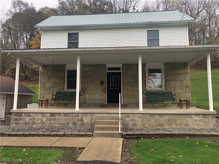 A beautiful country drive just minutes away from downtown Barnesville in Temperanceville (Barnesville mailing address).  Sit back and relax on the covered oversized front porch that includes 2 beautiful swings for relaxing and watching the world go by.  This home has beautiful stone work and a metal roof.  Nicely updated with newer floor, all appliances stay and is move-in ready with that much wanted Farmhouse Interior feel to it!  3 bedrooms, eat in kitchen, first floor laundry, spacious living room and a tiled office or family area for additional entertaining. Who wouldn’t love the one car detached garage along with the huge additional garage measuring 30 x40 with a wood burner and has plenty of additional parking.  Is it time to enjoy the country life feel?  Don't hesitate to make your appointment to see soon!