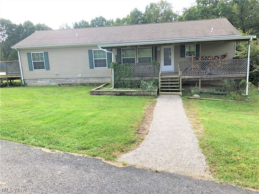 Country living at its best. This ranch home in East Muskingum Schools offers an open floor plan with beautiful hardwood floors. With 3 bedrooms on the main floor the walkout lower level offers room for more. With high ceilings in the lower level it is just waiting to be finished and has 2 partially finished bedroom down already. All of this is surrounded with 10+ acres, which include a large wooded area. Why leave home to go hunting? Simply walk out the back to some prime hunting ground.