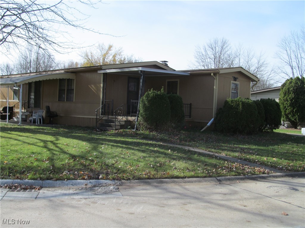 This 1981 Shultz Manufactures Home has been well maintained over the years. It features 1.344 square feet of living space. Recent updated include exterior professionally painted and heat pump replaced 08/2021. The interior is dated and awaiting your decorating touch. The large living room features carpeting, window treatments, cathedral ceiling, wood burning fireplace and ceiling fan. The entrance foyer has a closet, vinyl flooring and access to the covered front porch. The formal dining room has carpeting, a built in hutch and has access to sliding glass doors and a covered patio. The kitchen is an eat in kitchen with appliances, a pantry, ample cabinets and counter top space. This unit boasts three bedrooms and two full baths. The laundry room is located on the driveway side of the home with access to the covered driveway. The laundry room has access to a full bathroom. Columbia Park is a Gated and Age qualified Community. ( 55 and over). It features on site shopping adjacent to the community. The development boasts a Community Social Hall with many activities for the residents, walking paths, a Bark Park for our furry friend, shuffle boards, bocce ball courts, bingo, crafts, library, many fitness and health classes and numerous other activities. Come and join us in Ohio's Premier Adult Land Lease Community. this property is being offered for sale AS - IS. The owner has moved into an assisted living community and will not make any repairs or improvements to the property. This is a great opportunity to move into an outstanding senior community for someone willing to put some sweat equity or have you contractor make it into your vision.