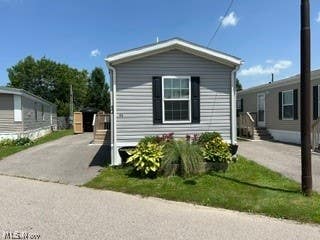 Photo of 12860 Mayfield Rd RD #52, Chardon, OH 44024 (MLS # 5224085)