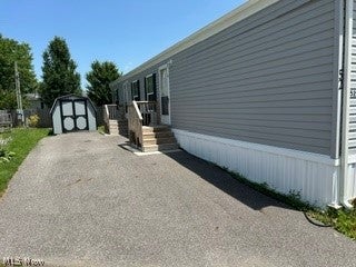 Photo of 12860 Mayfield Rd RD #52, Chardon, OH 44024 (MLS # 5224085)