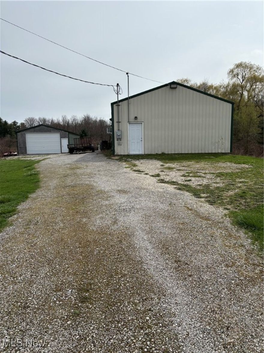 Commercial property with excellent location in Perry township.  Two metal buildings [ main building 1846 sq ft; green building 1200sq ft ] on 3 plus acres.   Presently used as a wood shop. Great for storage / warehousing
