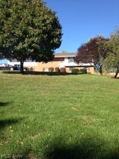 Spacious bi-level -nice lot. Lovely homes in surrounding area. 5 Bedrooms, 2.5 Baths. Finished lower level with extra Kitchen.