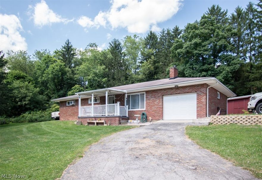 Welcome home!! This brick ranch in Beaver Local School District.  This well loved home is just waiting for your personal touches featuring 3 bedrooms, a large cozy living room with a nice fireplace and gorgeous hardwood floors. The updated eat in kitchen has plenty of room and also updated laminate flooring. The large basement has plenty of options for your finishing touches.  Sit on the covered porch and enjoy your mornings or evenings or the back patio by a nice fire.  The home is located in a quiet little quaint neighborhood.