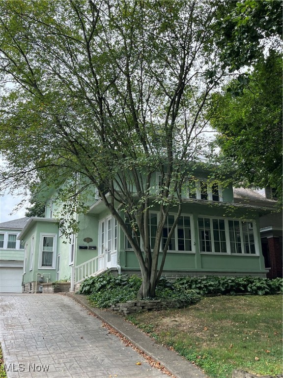 STATELY describes this beauty in Downtown Marietta overlooking Sacra Via Park!! Relax and enjoy the lush views of the park from the exquisite enclosed front porch with your morning coffee or favorite book! This home has been lovingly owned and enjoyed by the same family since 1969!! Beautiful crown moldings throughout, generous rooms, stunning lead glass window, and amazing built-in china cabinets with storage drawers and kitchen pantries. Four bedrooms and a finished attic allow for all your family needs!! Hardwood floors are believed to be under most of the carpeting but not guaranteed. The driveway leading to the two car detached garage is certainly a big plus-AND it has a one bedroom apt. above for an in-law suite or can provide income to supplement your house payment!! This one is a beauty admired for years by many!
Square footage does not include finished area in the attic.