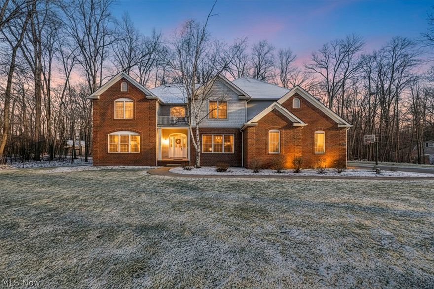 Discover the perfect blend of serene natural beauty and thoughtful luxury in Hinckley's sought-after Stone Ridge Estates. Tucked away on a spacious two-acre lot framed by lush woods in front and behind, this custom-built 2003 colonial offers a private oasis just minutes from the Cleveland MetroParks Hinckley Reservation, ideal for hiking, kayaking, and embracing nature’s tranquility.

Step inside to a grand two-story foyer that sets the tone for effortless living and entertaining. The open-concept layout flows beautifully from gathering spaces to cozy pockets of quiet retreat, making it easy to host gatherings or simply unwind. The stunning master suite serves as a luxurious private sanctuary, complete with a spa-like primary bathroom featuring dual vanities, a jetted soaking tub beside a gas fireplace, and an expansive walk-in closet.

Upstairs and throughout, you’ll find generous living space, while the fully finished basement adds exceptional versatility for play, work, or guests. Multiple highways are quickly accessible, offering convenient commutes without sacrificing the peaceful, secluded feel of the neighborhood.

This home delivers peace, space, and nature in one wonderful package. Enjoy the expansive backyard surrounded by woods and a sense of calm, where daily life feels like a getaway in a tranquil, private setting. Whether you’re seeking room to grow or simply reconnect with nature, this exceptional Hinckley home awaits.  Seller is a Real Estate Agent.
