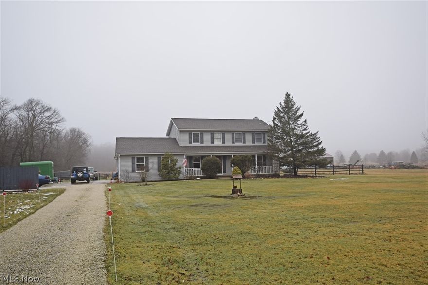 You must see this beautiful colonial on 5.98 acres accompanied by a 5-stall barn! This home has 2 master suites both with walk-in closets and bathrooms! First floor laundry. Eat-in kitchen has plenty of cabinet space and lots of room for entertaining, and it t opens up to the great room that also has a wood- burning stove. Home offers 3 full and 1 half bath. New tile in kitchen. All newer appliances stay with the home! Sliding door leads out to deck overlooking the back yard. First floor master has vaulted ceilings with beautiful beams and a door leading out to the deck. Two-car attached garage. The 5-stall barn has a wash rack, water and electricity. Two additional out buildings on the property can be used for storage or one also has extra stalls for the horse enthusiasts. Don't miss your opportunity to own this home! (Close to 224/ 76 Highways to Akron, Rt 18 to Fairlawn, I-71/ 271 and Rt 77 to Cleveland.)