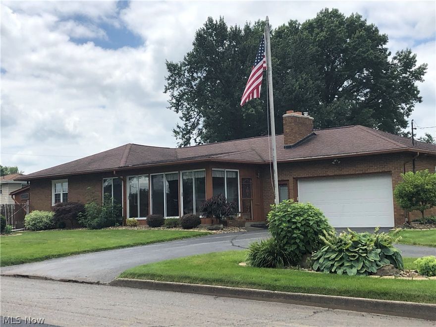 Welcome home to this all brick ranch in Campbell! This home features a large eat-in kitchen with new granite countertops, a spacious living room with fireplace, three bedrooms and a full bath.  Relax in the all-season room and enjoy the views of the beautiful neighborhood, with mature trees and perfectly manicured lawns.  The basement is finished with a large bar, full kitchen, fruit closet, an additional room that could be a fourth bedroom or an office, full bathroom and a laundry room.  This house has tons of storage. New windows, sump pump, roof and much more.  Beautiful original hardwood floors, under the carpet, throughout the home.