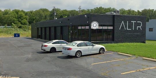 Available for sale or lease is this 3980 square foot former automotive repair shop located in Berea, OH. The property is in very good condition, with all required mechanical systems intact and ready to go. HVAC in the office area was replaced 4 years ago. Building exterior was recently painted. This shop has 6 bays with tall overhead doors. There is also a large concrete pad at the rear that previously held lifts for large trucks. The property is vacant, and is being offed as-is.