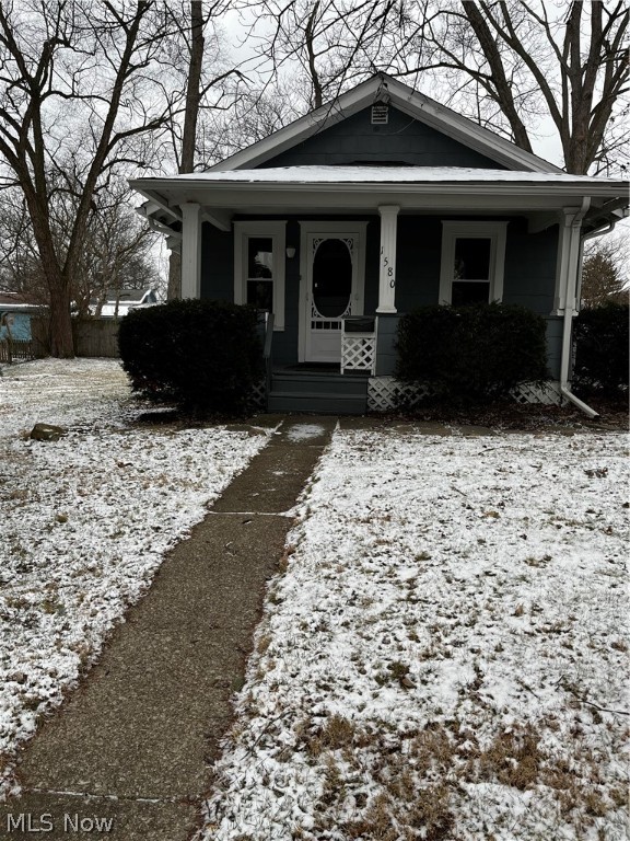 Welcome to this charming Bungalow nestled on a double lot. Step up to the cozy front porch and walk into the living room with shining hardwood floors. The soft gray walls are enhanced by the recently installed new windows and opens into the ample dining room. The kitchen features stove, stainless steel refrigerator and dishwasher. Large pantry and plenty of cabinets. The first floor laundry includes the washer and dryer and is just steps away. The recently remodeled bath (2022) features a double shower, shower doors, new vanity and fixtures, lighting, commode and flooring. Recent improvements include new roof 2020, new windows 2021, new carpet and luxury vinyl flooring 2021, exterior paint 2020, electrical box, dryer outlet and additional outlet in basement 2022. There is a convenient covered porch leading to the back door and shed for extra storage. Enjoy all the Falls amenities, Portage Crossings, Front Street dining, shopping, and entertainment amenities, the Natatorium and th