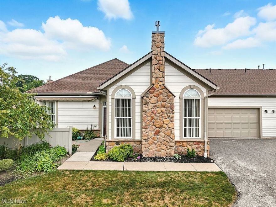 Welcome to easy living in the desirable Crossings at Northwest! This beautifully maintained 2-bedroom, 2-bath ranch-style condo offers the perfect blend of comfort and convenience. Located in a quiet community with amenities like a pool, fitness center, and serene lake views, this home is ideal for those seeking low-maintenance living without compromising on style. Inside you will find a spacious open floor plan featuring vaulted ceilings, a cozy gas fireplace, and tons of natural light pouring through tall arched windows. The eat-in kitchen includes ample cabinetry and countertop space, while the dedicated dining area is perfect for entertaining. The primary suite offers a generous layout with an ensuite bath and plenty of closet space. A second full bath and bedroom provide flexibility for guests or a home office. Additional highlights include in-unit laundry, an attached 2-car garage, private outdoor patio, and no basement to worry about. The monthly HOA covers water, sewer, landscaping, exterior maintenance, snow removal, and more—giving you peace of mind and more free time. Located in the Tallmadge School District and minutes from shopping, dining, and highway access. This is carefree condo living at its finest—schedule your private showing today!