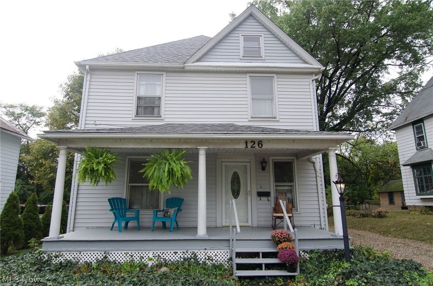 Absolutely charming colonial in the heart of Wadsworth!  From the hardwood floors with inlays, to base boards and archways, you will fall in love with all of the stunning original woodwork throughout this home.  Walk into the giant foyer, which would make a beautiful formal sitting or reading room.  The open living room flows right into the formal dining room then to the large kitchen.  The kitchen has lots of updates (2010) including tile floors, newer cabinets and counter tops, but has kept some of the original cabinetry that make this room unique and beautiful.  The range and dishwasher stay and the fridge and microwave are negotiable.  Up the lovely dark wood stairs to the 4 bedrooms and bathroom.  You will be amazed at the space on this floor.  A huge open center area will keep the family from running into each other!  There are 4 nice sized bedrooms, one with rustic brick of the exposed chimney.  In the bathroom there is a new vanity top & faucet, tile floor & updated lighting.