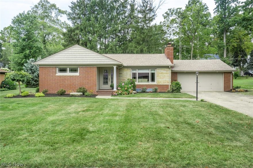 Beautiful totally remodeled home.  Newer windows, gorgeous,  refinished hardwood floors.  New kitchen & bath with tile & granite. 2 plus car garage. All brick home with walk up insulated attic.  Covered front porch & back patio.  Nice private lot.   Appliances to stay.  3 bedrooms & 1st floor laundry if needed.  Call  for details.  2 fireplaces. Roof 8 years old &  new hot water tank 2017.