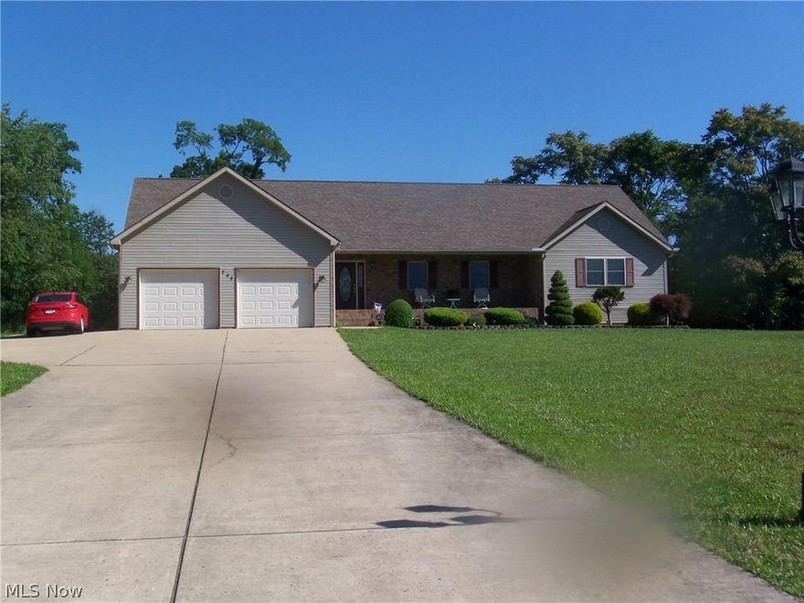 Beautiful brick/vinyl ranch on 1.4 acres.  Three bedroom, three baths and double garage.  Huge family/rec room in basement (47x26), full bath, storage room, workshop, walk-out basement and gas log fireplace.