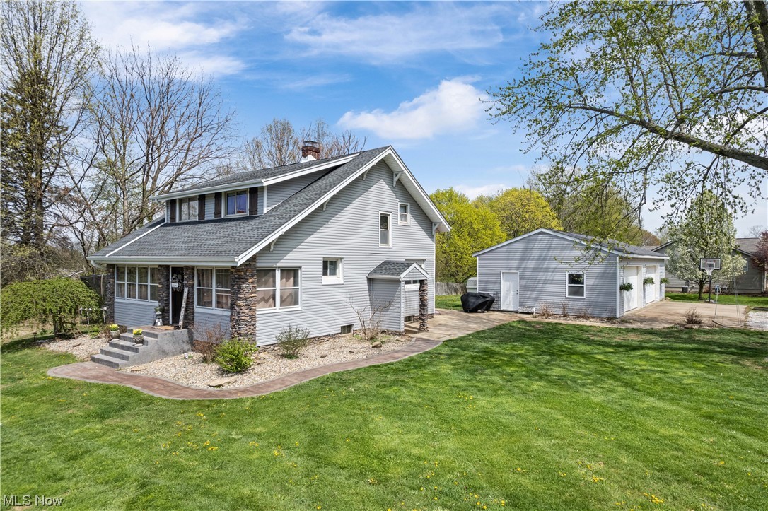 You are going to fall in love with this one! This modern farmhouse takes the relaxed farmhouse style and adds modern touches such as, a bright, open kitchen with custom wood cabinets, granite countertops and windows overlooking the patio and yard. Enjoy an open floorplan with the kitchen open to the dining room and spacious living room. This well-maintained home showcases original woodwork throughout, high ceilings, and still encompasses the original pocket doors in the dining room. The living room opens to the enclosed front porch which is just waiting for you to relax and sip your morning coffee. The first floor bathroom, recently renovated, offers a first floor laundry hookup! Upstairs, all three bedrooms are generously sized, and all offering plenty of closet space! The well designed master offers a skylight, walk-in closet and ensuite. The finished basement features a family room with built in bar area, and a bonus room previously used as an exercise room, currently as storage.
