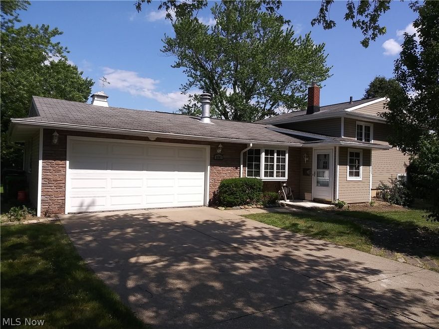 COME QUICK!!!  WON'T LAST!!! Inviting and open, welcome to this 3 bedroom 1.5 bath split level on one of the most desirable streets in Bedford Heights!  Several updates have been made to this home by the sellers, including a beautiful brand new 16 x 30 deck in 2019, perfect to entertain family and friends!  The exterior went through a fabulous beautification complete with all new exterior electrical and lighting fixtures, and siding! Enter the home from the front into the vaulted living room featuring a stone faced wood-burning fireplace with decorative wood mantle and new flooring running through the living and dining rooms (2019) along with partial kitchen renovation (2016) including new appliances, fixtures, counters and more! Beautiful chandelier in the dining room also added in 2019.  The 1/2 bath was renovated in 2018 and the north display wall on the lower level family room was completely rebuilt in 2019.   with an additional office space off the spacious family room on the lowe