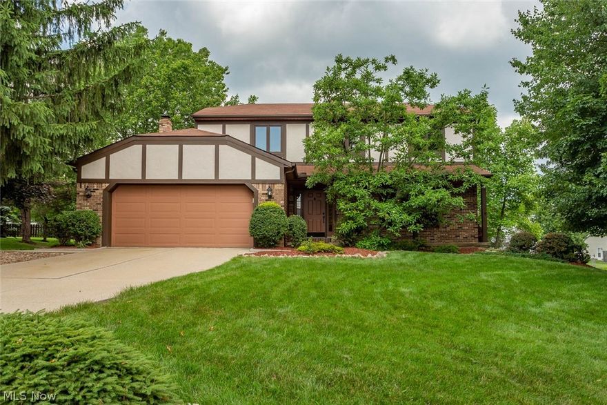 This is surely a dream home in a wonderful neighborhood. Surrounded by lovely trees, the homes many recent updates reveal quality craftsmanship.  . The exterior as well as the interior of the home is freshly painted with soft, cozy neutrals, and quality paint. The spacious and bright living room is covered with porcelain tile, leading to an open one of a kind designed kitchen.  Birch cabinets are highlighted with Mahogany crown molding with Travertine stone backsplash. The granite top island in the kitchen’s center is the favorite place to gather for meals. Double sliding doors lead out to the large, impressionable deck looking out to a beautiful lush green yard, with a quaint garden plot to the side. The stairs and second floor are finished with cherry hardwood. Seven new glass replacements in windows were installed. The master bedroom has a walk -in closet with Travertine stone in the custom-made shower. Main bath is also updated with ceramic rustic colored tile and new sinks.   Upst