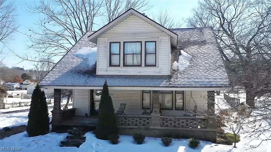 Welcome to this charming and well-maintained century home. Lots of character, spacious, original craftsman-style woodwork, hardwood floors, bright, many windows, and an airy feel from the moment you enter this lovely home. The great room has beautiful pocket double doors to the formal dining room on the main level. The eat-in kitchen offers appliances, a dinette area, a mudroom with a walkout to the deck, and a convenient updated full bath with tile surround walk-in shower & a fantastic deluxe full-body shower system. The main floor also has an office with many windows, an abundance of natural light, and a closet. The second level features four bedrooms and a full bath (two bedrooms have walk-in closets). The basement could be easy to finish into a living area/rec room and has glass block windows, a wood-burning stove, a shower, a laundry area, and plenty of storage space. Relax in the shade on your 12x20 rear deck with a fenced-in private backyard or your covered front porch. There is