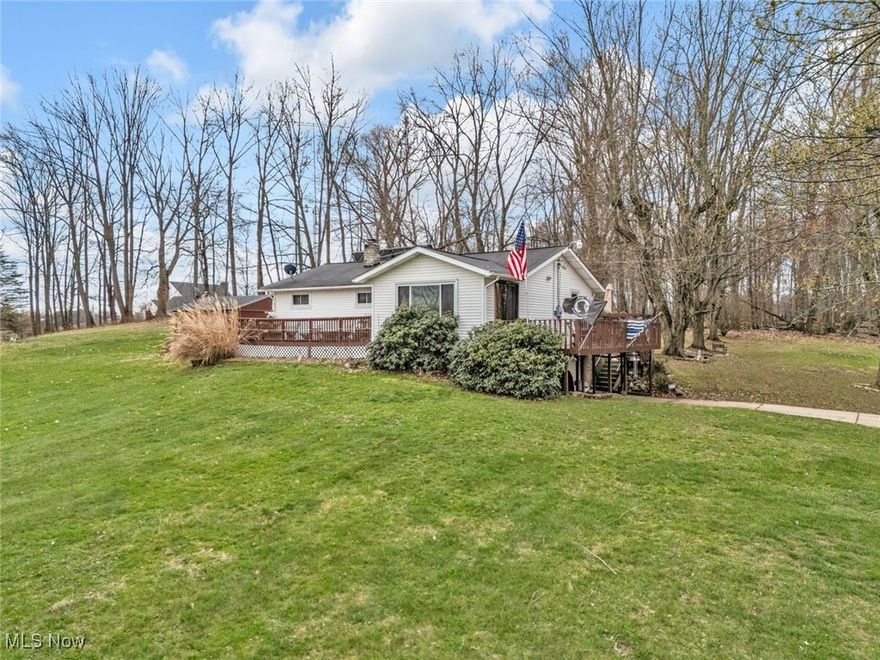 Nestled in a serene country setting with breathtaking sunsets, this property offers the perfect blend of modern convenience and rustic charm. Set on 1.64 acres of fully usable land surrounded by trees, this ranch style home provides privacy, space and high end amenities.  Inside, an open floor plan creates a bright and airy ambiance, enhanced by new windows that invite natural light. Two full baths, one on each floor, add convenience, while all stainless steel appliance complement the kitchen's sleet design. High speed internet and Massillon cable ensure seamless connectivity.  Step outside to experience true luxury. Two custom built wood decks, complete with electric hookups and a metal wicker foundation, offer the perfect retreat. Entertain effortlessly in the outdoor bar and pavilion, featuring electric lighting, a ceiling fan and TV hookup. A shed with electric and a massive 30x24 detached garage provides storage and workspace, while the one car attached garage also offers a workbench. An all concrete driveway leads to this exceptional home, where sandstone lined flower beds enhance the natural beauty of the landscape. Enjoy the warmth of oil heating in the winter and the fresh country air year round. This exquisite property offers the best of both worlds-peaceful country living but close to Rt. 30, Rt 77 & Rt 21. CONTINGENT UPON SELLERS FINDING HOME OF THEIR CHOICE.