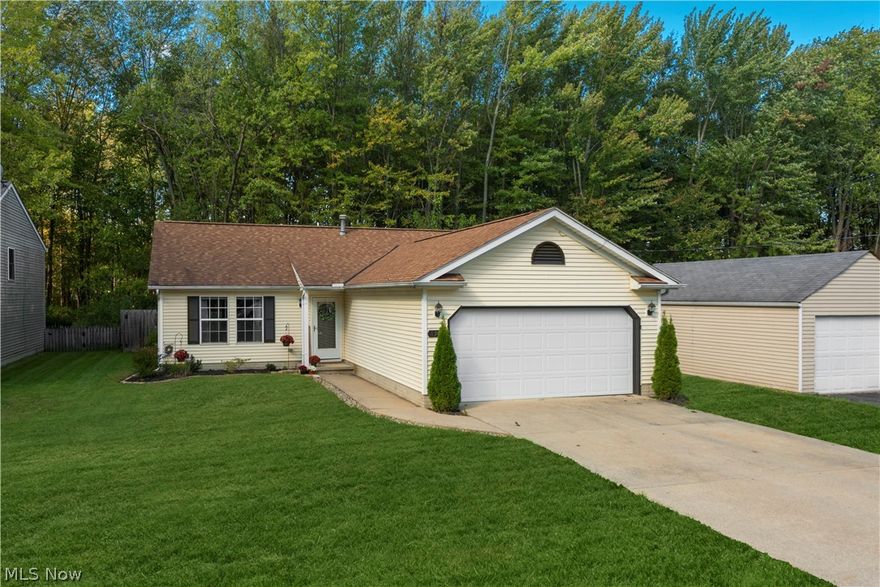 Enjoy convenient one level living in this Wonderful Ranch! The home features an open floor plan with vaulted ceilings. The kitchen has a breakfast bar, and all of the appliances stay, including dishwasher, washer & dryer. The living room has been painted in neutral gray tones and the home has 2 full baths. The oversized attached garage, with overhead storage, provides plenty of storage space and includes a 220 line. The roof was replaced in April 2007! 
Enjoy the best of both worlds, as this home has a lovely low maintenance fenced backyard, yet right behind it is a beautiful, wooded non-buildable area filled with nature. Nothing to do, but move in and relax with a cup of coffee, or glass of wine on the back patio. This home is close to all of the fantastic amenities that North Ridgeville has to offer, with shopping & highway access close by! Please call for your private showing today!