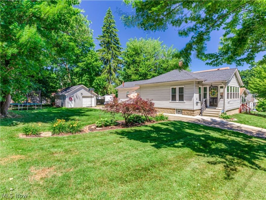 Move right into this cozy 2 bedroom, 1 bath Ranch. Kitchen with retro knotty pine cabinets includes all stainless steel appliances plus washer and dryer. Large master bedroom with double closets and baseboard heat. Updated bathroom in 2019 with bath fitter system, tile flooring, and vanity. Enjoyable enclosed front porch with wood flooring. Glass block windows. Furnace has been serviced and cleaned in 12/21. Newer concrete patio 2020. 1 car detached garage with electric and workbench. Extra gravel added for more parking. Oversized lot/spacious yard. Lots of updates include waterproofed basement 2016, newer roof on house & garage 2017, newer man door and garage door 2017, newer windows 2017, newer siding on garage 2017,  H2O tank 2019, A/C installed 2021.  Includes 1 year home warranty for peace of mind.  Schedule your showing today.  This darling house will not last!