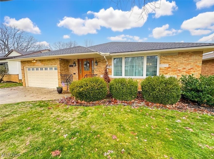 Welcome home!  This spacious, sprawling ranch features three bedrooms, two and a half bathrooms, formal living and dining rooms, large eat in kitchen, and so much more!  Admire the beautiful hardwood floors along with the custom crafted millwork and wainscoting throughout the home. The expansive family room features an updated fireplace and beautiful bay window with views overlooking the golf course. The large finished basement provides TONS of additional living spacing including a full bathroom and second laundry area as well as plenty of room for a home gym or hobbies.  A masterfully crafted, extra wide staircase leads to the second story which provides ample storage or could potentially be finished to provide even more living space.  Other wonderful features include an attached 2 car garage and first floor laundry room for your convenience. Updated furnace and central air conditioning along with Andersen windows ensure this home will be comfortable in all seasons. Enjoy outdoor time on the private cedar back deck overlooking the third hole of the course, or at the nearby Veteran's Memorial Park.