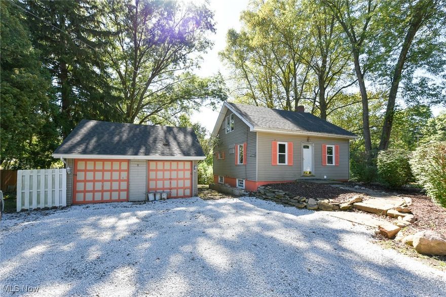 Affordable remodeled Cape Cod in Coventry Schools on nearly 1 acre lot with HUGE backyard! Large detached two car garage with newer garage door opener. Freshly graveled driveway. New laminate flooring in dining room and kitchen. Freshly painted throughout. Kitchen offers new white cabinets and attractive countertops with tiled backsplash and includes both a stove and refrigerator. Separate dining area offers a comfortable space for meals. Mostly newer vinyl double paned windows. Remodeled bathroom with tub enclosure and newer vanity. Two generously sized bedrooms upstairs. Walk through the lower level and up to third bedroom on main floor with trayed ceiling, half bath and door to newer wood deck overlooking expansive backyard. Partially finished basement with rec room. Glass block windows. Updated electrical panel. Conveniently located, move-in ready with great lot in Coventry!