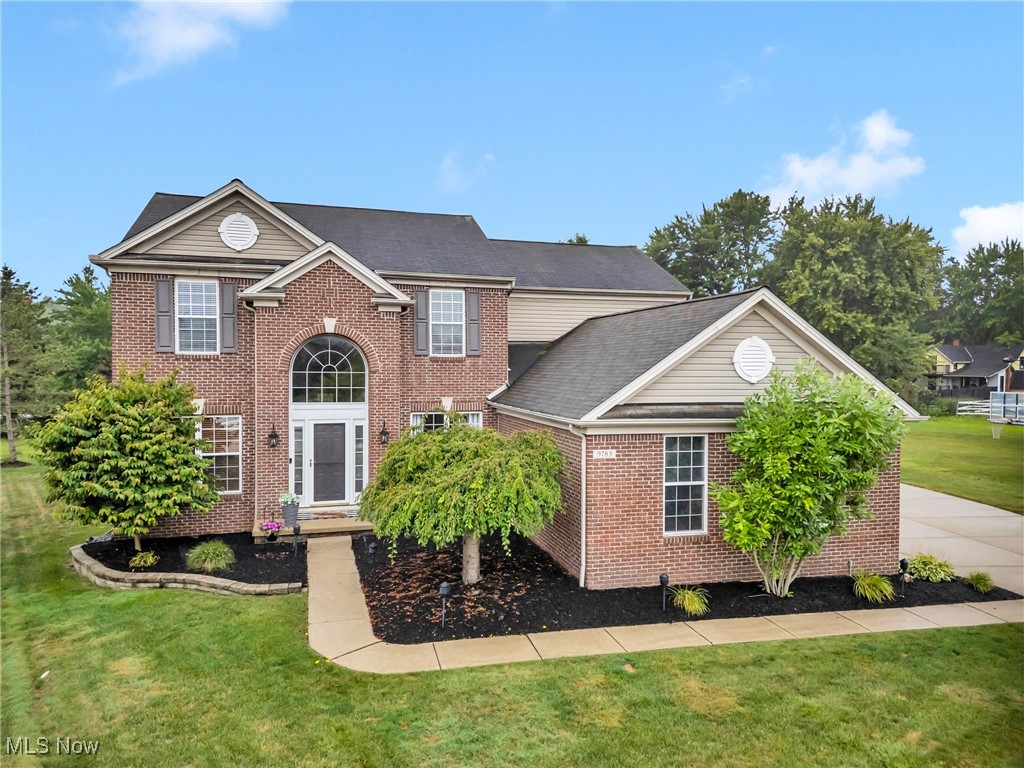 Stunning Brick-Front Colonial on a Prime Cul-de-Sac Lot in Olmsted Township! This home is designed for comfort and entertaining. Spacious 4-bedroom, 2.5-bath features 3 Car Garage with extension, hot and cold water access and extra wide driveway. Step into the Open Two-Story Foyer with hardwood floors, flanked by Formal Living and Dining Rooms flexible for Office or Additional Living Space. Spacious Great Room includes a Gas Fireplace and opens to a beautifully Updated Kitchen with an oversized island, soft-close cabinets with pullouts, subway tile backsplash, walk-in pantry, custom built-ins, and hardwood flooring throughout. The vaulted Morning Room offers recessed lighting, custom blinds, and overlooks a Private Wooded Backyard with stamped concrete patio and fire-pit. Main floor Guest Bath, first floor Private Den with full wall shelving, and Laundry/mudroom with washer/dryer hookups, cabinets and storage area. Primary Suite features vaulted ceilings, sitting area, LVP flooring, walk-in closet, and a luxurious bath with tiled shower, soaking tub, updated cabinets, solid-surface countertops, and upgraded lighting. Three additional bedrooms with LVP flooring share an Updated Full Bath with tile and glass-door tub/shower. Expand your living space with the industrial-inspired finished lower level spacious Recreation Room with carpet, built-ins, and great storage space, perfect for media room, play room, home gym. Additional highlights: Sprinkler System, invisible dog fence (front/sides/back), full concrete walkway, and wooded views. Olmsted Falls Blue Ribbon School District! This home features timeless style with modern updates in a Prime Location.....truly move in ready!