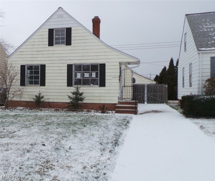 Three bedroom bungalow with lots of potential.  Hardwood floors, spacious kitchen.  Use your imagination and make it your own.  Property sold AS IS.