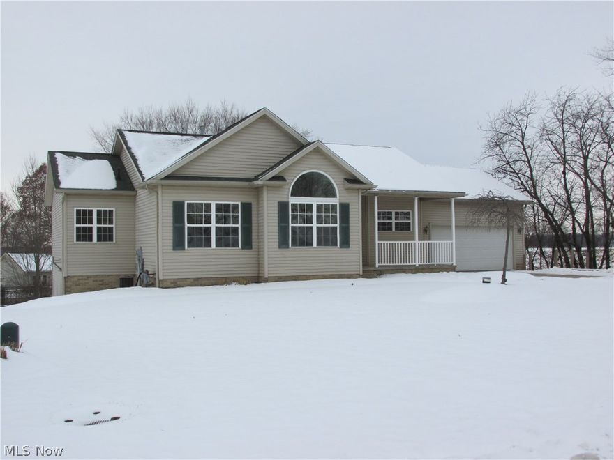 Spacious Raised Ranch with beautiful lot in Sunscape Development. Open floor plan with great room, large bar in oak Kitchen and Dining area including sliding doors to large deck with beautiful views. Must see the Lower Level of this home with walk out, huge family room and 1/2 bath, all ready for additional living space! Main floor laundry, large master suite with tub, shower, double vanity and walk in closet! Home has newer flooring. Call today for a tour today!