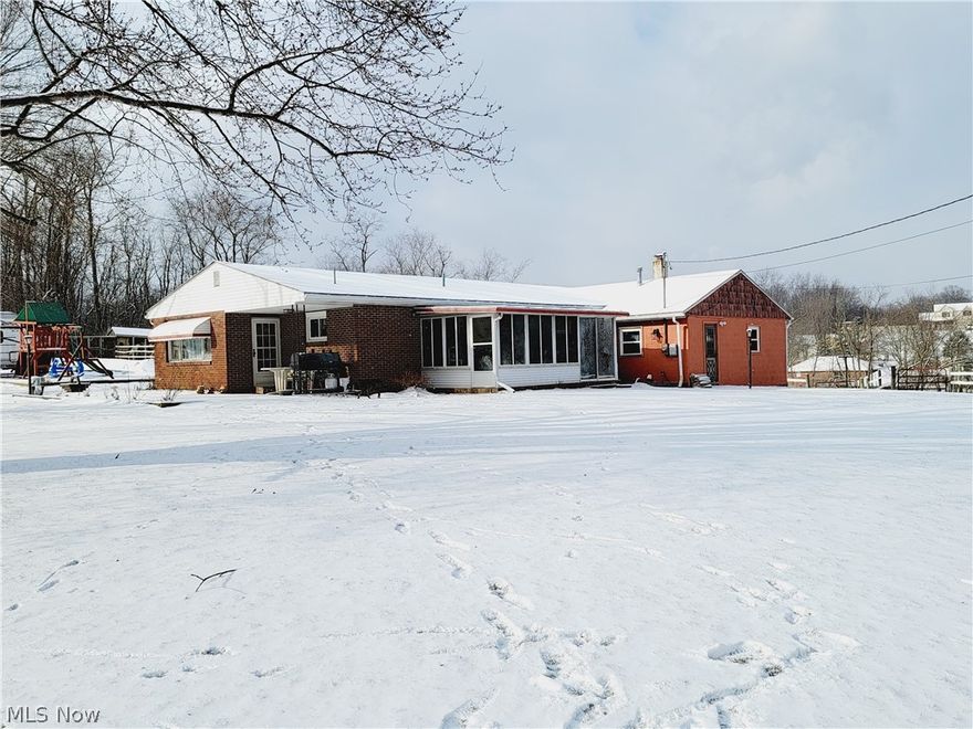 Mini horse farm w/motivated seller for this 3 bedroom brick ranch w/2 baths, additional 4th bedroom w/full bath & equipped laundry.  Many updates, roof 2010, furnace 2006, most windows replaced, laminate flooring in bedrooms, 2 stall barn, tack room, run-in shed, chicken coop, electric fencing & 4 car garage + carport.  Enjoy the sunny days in the enclosed porch w/privacy.  A very well kept property.  Call today.