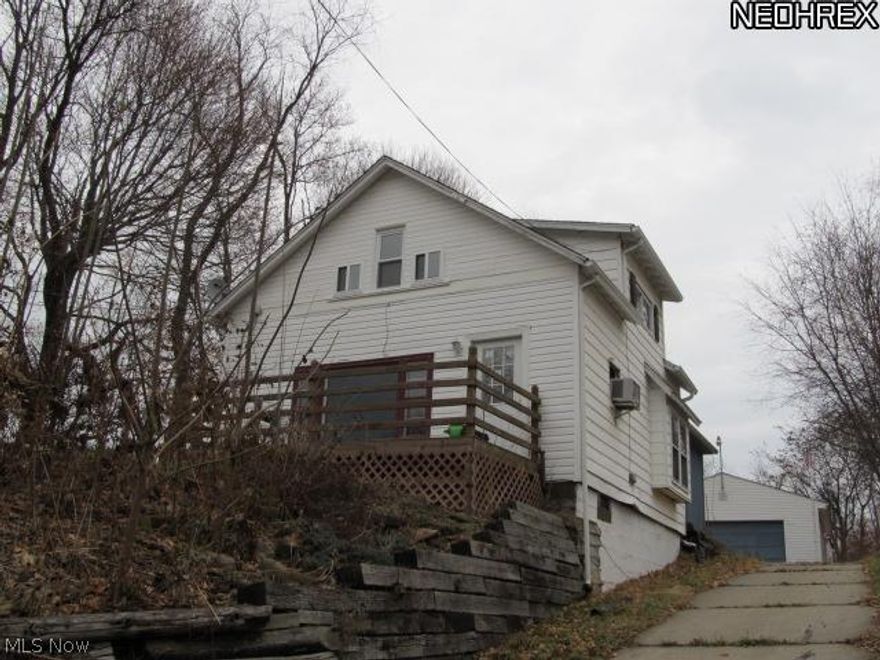 Very cute 2 bedroom Bungalow with plenty of potential!  Stone fireplace! Located on half an acre of land!