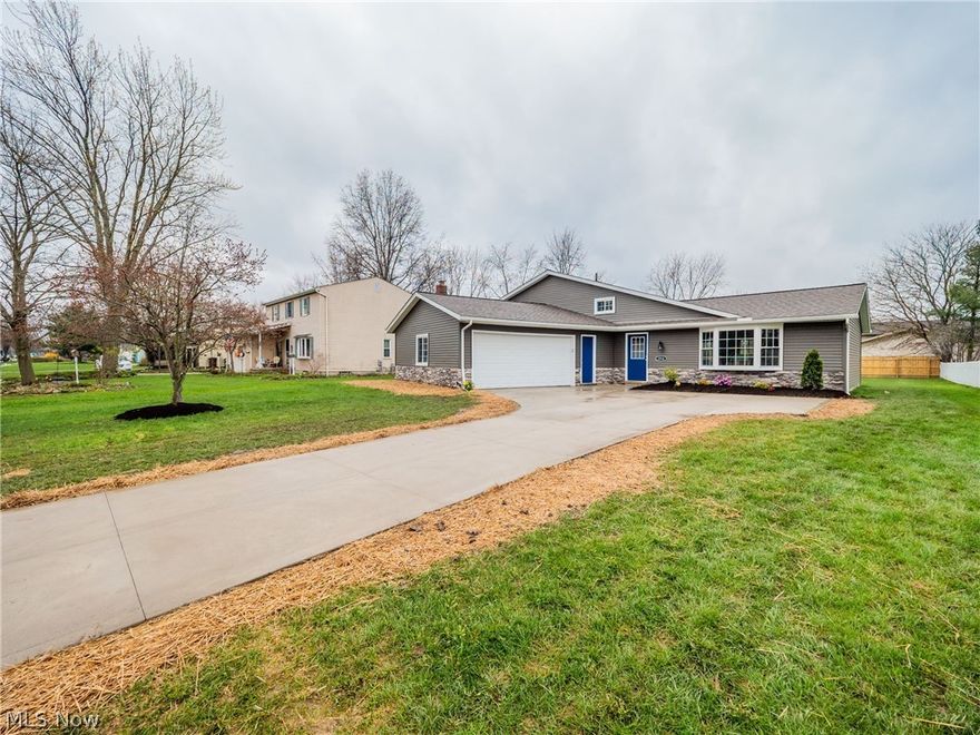 This completely renovated, gorgeous split-level home located in the sought-after Westlake school system is better than new! This magazine worthy 3-bedroom, 1 1/2-bath home features an open-floor plan with vaulted ceilings and an abundance of light that will take your breath away! You will fall in love with the beautiful granite countertops, trendy backsplash, and top of the line appliances. The focal point of the family room is the whitewashed brick fireplace that stretches the length of the wall. Upstairs you will find three good-size bedrooms and a stunning full bath with a double vanity that you can access from the hallway as well as the main bedroom. There is an attached 2-car garage with an entry into the oversized laundry/mud room for added convenience. Charming glass doors lead to the large, fenced, private backyard. Call today – this one will not last!