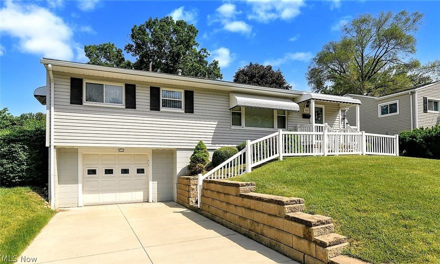 *Beautiful Raised Ranch In Ellet W/1800+ Sq. Ft Of Finished Living Space Including 3 Bedrooms, 1 Bath, Attached Garage & FINISHED Basement W/2nd Kitchen For Entertaining! *SOLID Property Inside And Out! *Major Updates Include: New VINYL SIDING, WINDOWS & ROOF  *New CONCRETE DRIVEWAY, RETAINING WALL & VINYL RAILING *Updated SLIDERS In The Sunroom Addition *2020 Genie Garage Door Opener *Walk In To A Large Living Rm W/Picture Window *Eat In Kitchen W/Updated Hunter Ceiling Fan & Led Light Provides Tons Of Cabinets & Is FULLY Applianced With Refrigerator, Dishwasher, Stove & Microwave *Sunroom W/BEAMED VAULTED 10' Ceiling Flanked By Sliders To The Front AND Back Yard!! *Bdrm #1 Has Ceiling Fan W/Convenient Built In Belt/Purse/Scarf Holder *The 2nd Bdrm Has Double Clothing Racks & 3rd Bdrm W/Ceiling Fan *1st Floor Bathroom Showcases TILE Floor, CUSTOM Wall To Wall Vanity & Countertop, Black Accent TILE Backsplash & Tub Surround! *ENTERTAIN In The FULLY FINISHED LOWER LEVEL!! Consisting Of