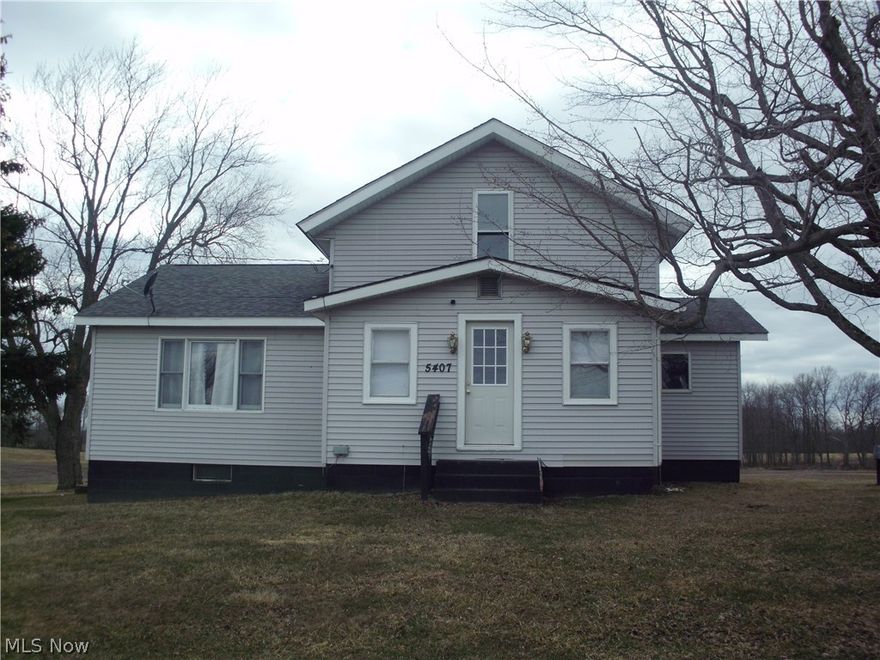 Cozy, former farmhouse in very rural south-central Ashtabula County on 8.5+ acres with a pond. This is real country living! This vinyl sides home is just south of US Rt. 6, close to St. Rt. 11 for easy access to I-90. Rear entry foyer has a new door and vinyl storm door (2022). Appliances stay with this country kitchen. The large dining room with new ceiling fan and vinyl sliding doors, offers access to a huge deck with a nice, wooded view. The huge Living room has new vinyl window and new ceiling fan (2022). The bonus room can be used as an office or additional bedroom. There is also a full bathroom on the first floor and an unfinished half bath in the basement. There are also two bedrooms on the second floor. The laundry is in the two-room unfinished basement along with water heater (2015) and furnace (2015). Upper roof new in 2012 and lower-level roof new in 2019. Huge 10 car pole building has a concrete floor, large overhead door and new man door (2022).
