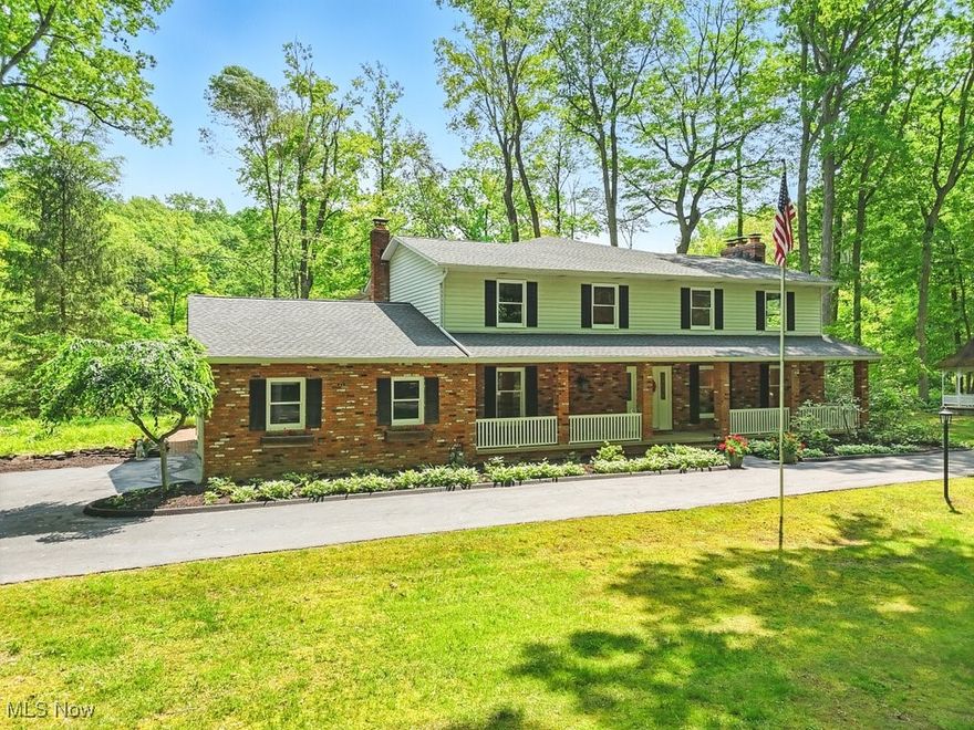 A one-owner custom home surrounded by the Cuyahoga Valley National Park on more than 2.5 acres with over 400 feet of frontage on a cul-de-sac, offers breathtaking views of nature. The dramatic foyer offers custom millwork. Separate living and dining rooms offer spacious rooms for entertainment. The kitchen has custom granite counters, island, double ovens, a large pantry, and travertine flooring. A large eating area overlooks a hearth room with fireplace. The great room is more than 24 feet by 36 feet with expansive windows, spectacular views of a creek and ravine and a dramatic 21-foot cathedral ceiling. The first floor has a spacious bedroom and fully renovated bathroom with custom shower. There is also a private office and separate laundry room. Upstairs you will find two spacious bedrooms and a spectacular master. One of these bedrooms enjoys a large loft over the great room for relaxing. These two bedrooms enjoy a fully renovated custom bathroom with high end finished. The enormous master retreat offers a cathedral ceiling with a wood burning fireplace and custom walk-in closet. The bathroom boasts a wet room with double shower, a free-standing bathtub and custom floor to ceiling glass. Double vanities with marble tops, high-end fixtures and a water closet mean you will never want to leave this sanctuary. Off the master retreat is a loft over the great room offering more spectacular views and a Trex exterior deck. The home's exterior walls are all extra 2 by 6 construction and heavily insulated. The home has a four-zone hot water heating system. A new air conditioning system includes a separate upstairs system that is Wi-Fi controlled. New items include many Pella custom windows, a tankless hot water heater, new carpeting and flooring, new appliances and new electrical box. The house has also been fully renovated and painted. Outside is another outbuilding of nearly 1,000 square feet where you can park three additional vehicles and enjoy a workshop area.