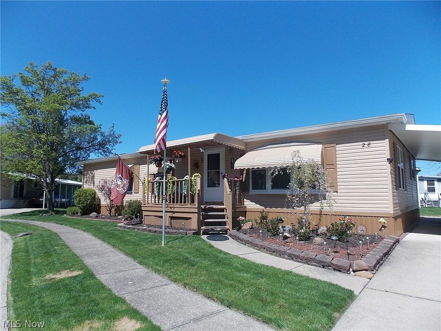 Welcome home to first floor living.  This 2-bedroom, 2-bath manufactured ranch home is located in Columbia Park in Olmsted Township.  Drive up and notice the paved driveway and 1-car carport for parking.  Walk inside from the covered front porch into the living room.  The kitchen has an eating area as well as an area to put a dining room table.  the back door leads to the deck to enjoy on warm days/evenings.  Head back to find the owners suite complete with a full attached bath.  There is another bedroom and another full bath.  There is main floor laundry for your convenience.  Owner is responsible for electric, water, and sewer.  Schedule your private showing today before it's sold!