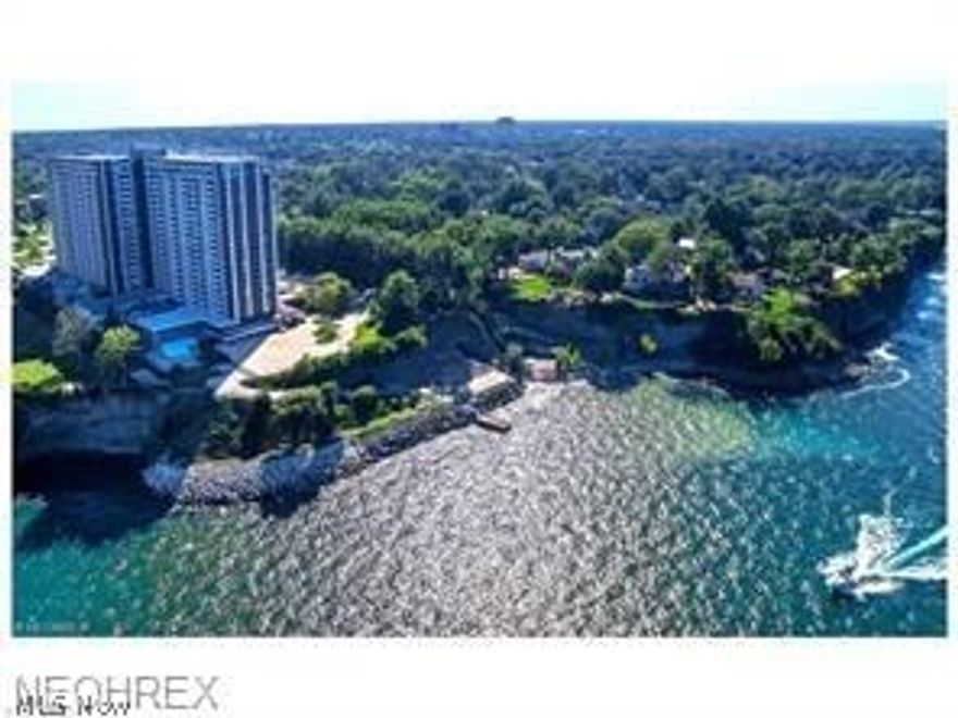 #PH 27-Townhouse in the sky! Spectacularly remodeled two bedroom 1.5 bath Penthouse suite. Experience expansive views of Lake Erie way over the tree line, picturesque sunsets, and the tranquil sounds of water from your private balcony.This beauty features a granite tiled foyer, open granite kitchen, lovely newer cabinetry, stainless steel appliances, porcelain tile flooring, 5" baseboards, new carpeting throughout, 10' ceilings downstairs as well as walls of windows to showcase the ever changing views.The mirrored dining wall acts to bring more of the Lake Erie water view into the suite. Also included is all new lighting and satin nickel hardware throughout, recessed lighting and wall sconces. The downstairs half bath has a modern art glass Ronbow sink on top of wall mounted newer cabinetry and porcelain tile flooring. As you enter the upstairs, you will notice the custom designed railing with ironwork designed by Rose Metal Industries, newer bath cabinet and flooring in the full bathroom. All of the closets are equipped with walnut finished Elfa custom closet systems, also with a large walk-in closet in master bedroom with large mirror. One heated garage space and one storage locker. The Carlyle boasts a 24 hour reception desk and security, indoor/outdoor pools, sauna, jacuzzi, fitness, laundry, game room, two party centers, hair salon, and deli.  The amenity levels are currently undergoing beautification and a new restaurant is expected in the spring.  Prepare to be amazed!