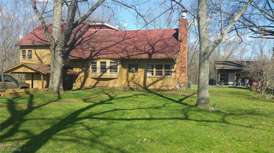 Tons of character in this updated Tudor style farmhouse. This unique 4 (possibly 5) level split has plenty of room and storage! Enjoy 4 bedrooms, 2 bathrooms, open main floor-plan, gorgeous fireplace, hard wood flooring, stunning exposed beams, all new kitchen (appliances stay!), new bathroom with separate tub & tile shower, huge master bedroom, 18x25 outbuilding with covered porch, basketball court and so much more in the beauty! Private wooded 3.58 acres is perfect for entertaining, family cookouts, children and pets! Move right in and start your summer off with strolls on the trails through the woods, enjoy fruit trees and have bon fires in the fire pit. Many major updates have been completed already... Newer furnace and a/c, new well pump and more updates including a new roof, new gutters and new siding are in process. This is a true gem for the savvy buyer. Sellers are sad to sell due to a job relocation. Located close to shopping, dining, parks, schools and the highway! Schedule