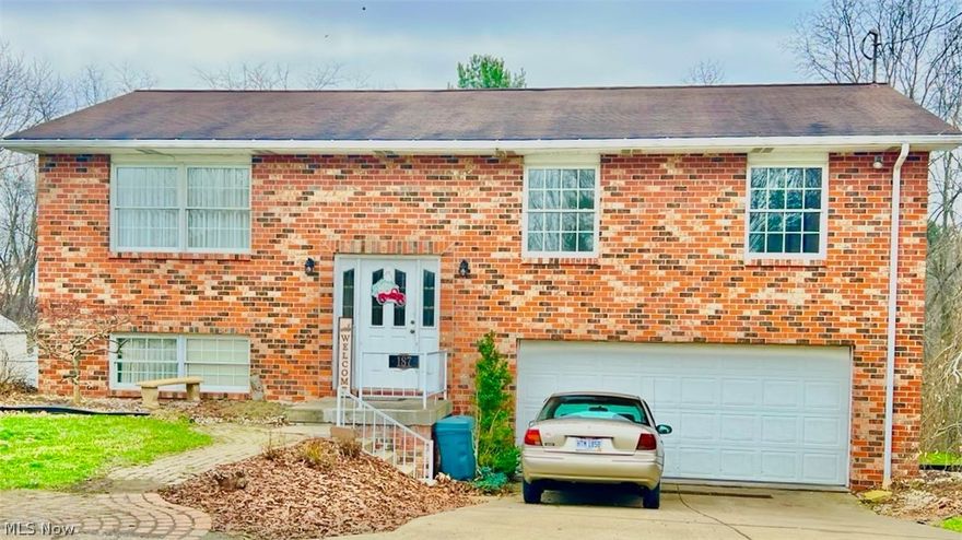 Welcome 187 Skyview, 3-bedroom, 2.5-bath brick home located in the desirable Wintersville area, just a short drive from shopping, restaurants, and everyday conveniences. Inside, the home offers a bright and open feel with vaulted ceilings and a layout designed for comfortable living.

The main living space provides plenty of room to relax and flows naturally into the dining area, where sliding doors lead out to a private deck overlooking the backyard. The kitchen features abundant cabinet storage and counter space, along with an eat-in area for casual dining.

The primary bedroom includes its own private full bathroom, while the additional bedrooms are generously sized. Downstairs, the finished basement offers a versatile recreation room, a convenient half bath, and walk-out access to the backyard, making it a great space for entertaining or additional living space.