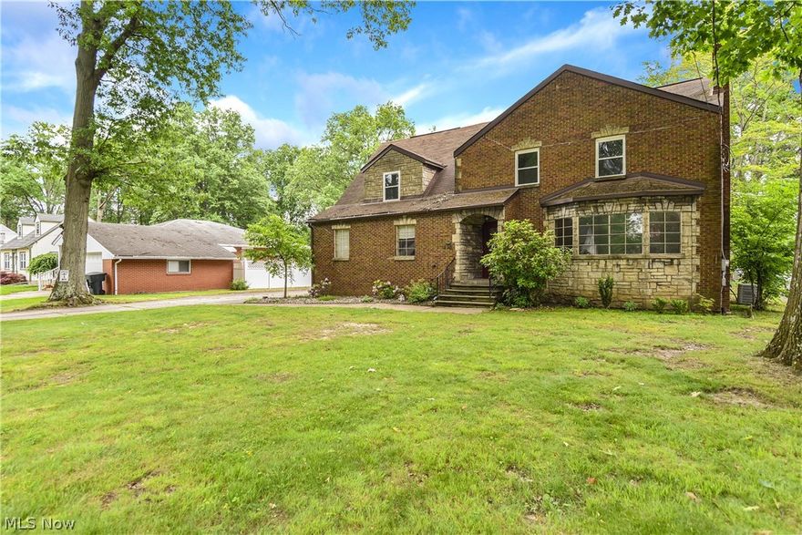 An all brick home with wonderful stonework facade, it combines old world charm with modern upgrades. There are gorgeous hardwood floors throughout this 4 bedroom house with quaint, retro features that are impossible to find today. Upgrades include, new windows, whole house Central Air, Added Bathroom and remodeled addition with handicapped access and 10 space parking lot, which is tailor made for a home based business.  Electric panel is 4-5 years old.  Home Warranty included.