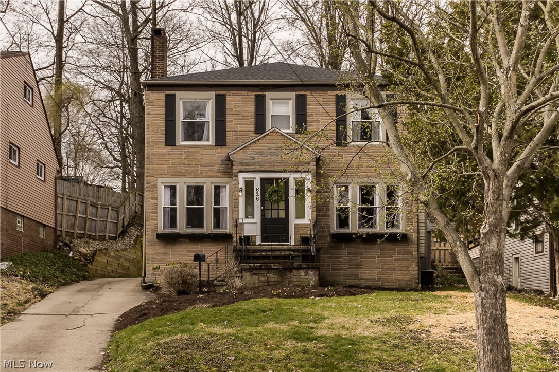 Don't miss this beautiful and light filled classic colonial on a charming red brick road in Highland Square! Exceptional property with many updates. On the first floor you will find a large living room with fireplace that opens to both the spacious dining room as well as a den with built in shelves. Toward the back of the home is a bright and sunny kitchen that leads out to a sun porch and the charming back patio and yard. A half bath finishes off the first floor. Upstairs you will find 4 very nicely sized bedrooms and a large full bathroom, plus a walk up attic, perfect for additional storage. Large basement with very high ceilings lends itself to much potential. Modern neutral paint throughout! Recent updates include roof in 2017, waterproofing and new water line to the street in 2018, updated electric, a rebuilt retaining wall in 2016, and many replacement windows throughout. Home warranty included! This one is a must see, move right in and enjoy!