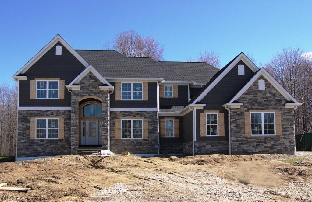 New Construction by Simcon Homes – framed and ready for your special touches. Stunning stone front transitional with a 3 car garage on the cul de sac with golf course views. The two story foyer opens to the two story family room with a stone fireplace and walls of windows. There is a living room and dining room as well as an office/study or 5th bedroom with an adjacent full bath. The spacious kitchen features a center island, granite, an abundance of cabinets and appliances – your choice within the allowance. All bedrooms are on the second floor with the master suite featuring a volume ceiling, his and hers walk in closets and a glamour bath with double vanities, a custom shower and tub. There other three bedrooms are generously sized all with bath access with one being an ensuite. Plenty of room for storage and a future recreation room in the full basement plumbed for a bath. First floor laundry with mud room and lockers. Summer occupancy. Still time to make all the interi