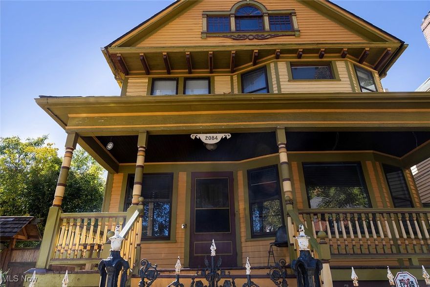 Here is a rare opportunity to own a truly gorgeous home with the most spectacular gardens in Ohio City! The vintage beauty of this home is matched by lush landscaping and a serene lily pond, all situated on a double lot. The elegant, yet welcoming, entry foyer is graced with gleaming oak columns leading to the living room featuring lovely natural woodwork and decorative fireplace. Enter the dining room through the pristine hardwood pocket doors. There, an amazing leaded glass window above the window framing the view of the gardens. Wood floors and natural woodwork can be found throughout this 3 to 4 bedroom home. The kitchen offers ample work space and storage, with wood cabinets, and a new stainless steel microwave and dishwasher. There is a butler's pantry providing additional storage. The second floor has three large bedrooms and two full baths. The primary bedroom features an ensuite bath with hard surfaces and a tiled walk-in shower. On the third floor is a large flex space with plenty of natural light and ample headroom; suitable for a home office, studio, or work-out area. A huge third floor full bath provides an opportunity to turn this space into a luxurious primary bedroom suite. Along the rear of the house is a large deck great for entertaining, or for relaxing by the tranquil lily pond waterfall. Stone paths wind through the trees and the flower beds found throughout the rear and side yards. The gardens are filled with perennials, decorative plantings and a sculptural sandstone fountain. Located just two blocks from the West Side Market, within walking distance of the great dining and entertainment Ohio City has to offer! A unique property in so many ways! Please do not tour the property without an appointment.