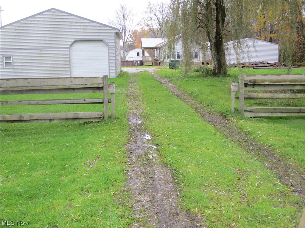 Lease is being written, but look at the listing next door. Modular home on a nice country setting with a great added on laundry/mud room and a back deck and a front covered deck. You have use of your two acres and large pole barn (it is a great drive in and out with concrete and electric,great for camper storage) and a 2 car detached garage. Landlord does all the mowing and included in the rent. Tenant is responsible for trash, snow, and electric (all electric home so you need to bring your own a/c units and your own fridge,laundry may be negotiable). Only 17 miles from Chardon and 18 miles from Middlefield. Easy access to I-90 to go to Cleveland or PA. You have great driveway space with an extra driveway length to park on, which is not to be used to drive out to the neighbor's driveway that is adjacent. There is a 24 x 24 detached garage, gravel floor and a 32 x 48 1,536 Sq. Ft pole building with a concrete floor. You rent the 2 acres, not the property behind your yard/field. Electric baseboard heat and a wood burner stove in the central part of the living area! If you have a need for this pole building, you will really want this property! NOT FOR COMMERCIAL USE. Bring your own fridge, tenants will probably take their washer and dryer with them. Out going tenant will sell there A/C units(new this year). This home on 2 acres is with the 2 car detached garage and the pole building.
