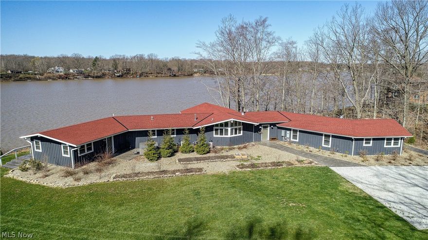 This is a lakefront retreat, not just a lakefront home.  The original home was completely rebuilt and remodeled in 2015 and an in-law wing and master suite were added.  Enjoy serene views of the Lake from nearly every room, and the sunset views across the Lake are unforgettable.  Concrete countertops throughout. New roof, heating, plumbing and electrical systems and radiant heated floors in both the master suite and in-law wing.  Stamped concrete patio connects one end of this sprawling ranch to the other.  Multiple outdoor entertainment areas balanced with private, quiet nooks, an expansive screened-in porch and fire pit.  Extensive natural landscaping with boulder walls, breathtaking wildflowers and low maintenance perennial gardens.  The kitchen garden is ready for your herbs and vegetables to feed your family and friends. Dock includes two boat hoists and a middle slip. Heated three car garage with plenty of storage space. Includes an automatic back-up generator to support the enti