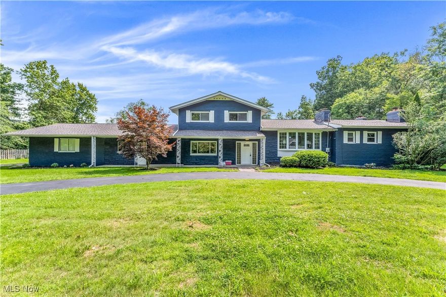 Stunning, fully renovated split-level home on over an acre in Hudson! This exceptional property combines modern design, high-end finishes, and spacious, light-filled living areas throughout! The exterior impresses with fresh slate-blue paint, a welcoming covered front porch with wrought-iron pillars, and a convenient horseshoe turnaround driveway.
Inside, discover 5 bedrooms, 3.5 bathrooms, and 4 fireplaces! The main level features a formal living room with large bay windows and a brick accent wall, plus an open-concept kitchen and morning room filled with natural light. Elegant white cabinetry wraps the space for abundant storage, complemented by granite countertops and a center island with bar seating.
A luxurious rear family room showcases a striking stone fireplace and sliding doors to the deck—perfect for entertaining or relaxing at home! The first-floor master suite includes its own fireplace, a full ensuite bath, and convenient access to first-floor laundry and a powder room.
Upstairs, find three additional bedrooms, including a large ensuite, plus a beautifully updated main bath. The lower level offers another family room with fireplace and walkout access to the patio, along with a fifth bedroom—ideal for guests or a home office.
Outside, enjoy the expansive backyard and a 4-car garage with workshop space! Recent updates include newer HVAC, roof, electrical, paint, and fixtures, making this home move-in ready. This Hudson gem offers style, comfort, and elegance—schedule your showing today because it won’t last long!