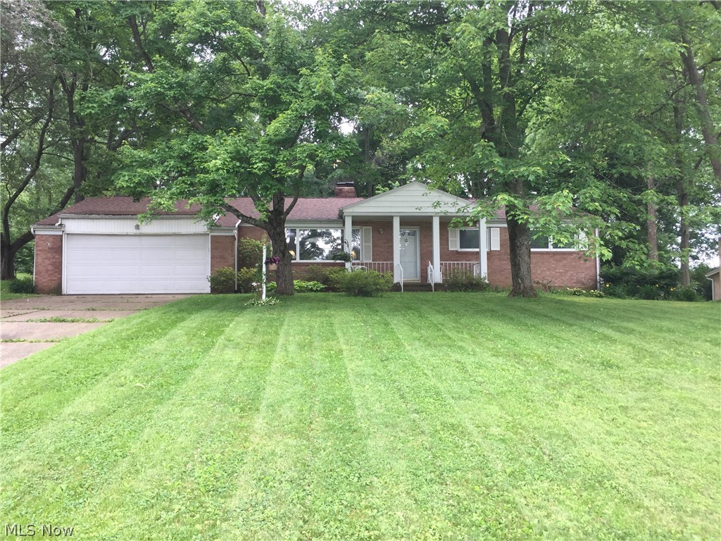 Good brick home in quiet neighborhood priced to sell! The floor plan is friendly with good proportionality of rooms. The main bathroom is updated with a therapy tub, newer vanity, sink and commode. The kitchen cabinets are updated; all vinyl flooring is newer. The living room is spacious and enjoys good natural lighting and has good connectivity to the dining room and kitchen spaces. The kitchen offers very good counter space and a pantry. The family room is embellished with a fireplace and sliding doors to the 3-season sun room, leading to a large fenced in back yard with mature trees. The electric service box is new 2014, well pump 2016, roof shingles approx. 2015, attic insulation added 2011, water softener 2010, garage overhead door 2011. Will not qualify for FHA or VA loans.
